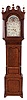William Waite, Burslem, England, tall clock, 8 days, time and bell strike, weight driven movement in an oak case with mahogany veneer and string inlay accents with painted iron dial with moon phase, second's bit and calendar.