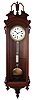 George A. Jones & Co., New York, hanging regulator, 8 days, time only weight driven movement with sweep center seconds in a walnut, Vienna-style regulator case with Roman numeral white enamel dial, gridiron pendulum with brass ball, c1875.
