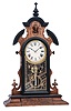 Clocks- 3 (Three): (1) F. Kroeber, New York, "Japanese" shelf clock with an 8 days spring driven brass time and strike movement in a walnut case. c1875. (2) George B. Owen, Winsted, Conn., "Panel" model shelf clock with an 8 day spring driven brass time and strike movement in a walnut case. c1878. (3) Unsigned, but New Haven Clock Co., New Haven, Conn., (similar to New Haven's "Apollo" model) miniature mirror side shelf clock with an 8 days spring driven brass time and strike movement in a walnut case, c1885;