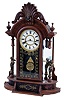 Clocks- 2 (Two) walnut 8 day time and strike parlor clocks: Ansonia Clock Co., New York, NY, "Monarch" with drawer; New Haven Clock Co., New Haven, Conn., "Occidental"; both c1890