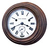 Seth Thomas Clock Co., Thomaston, Conn., "Wardroom" wall clock with a one-day spring driven time and ship's bell strike movement deeply turned in a mahogany case,