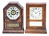 Clocks- 2 (Two): (1) Seth Thomas Clock Co., Plymouth Hollow, Conn., octagon top "Cottage" clock with a 30 hour time and alarm movement in a rosewood veneered case; c1865 (2) Seth Thomas Clock Co. Plymouth Hollow, Conn., flat top. "Cottage" clock with a 30 hour timepiece movement in a rosewood veneered case; c1865.