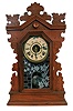 Clocks- 2 (Two): (1) New Haven Clock Co., New Haven, Conn., "Tampa", 8 days, spring brass movement calendar wall timepiece. c1911 (2) William L. Gilbert Clock Co., Winsted, Conn., "Owl", 8 days, time and strike spring brass movement shelf clock. c1891