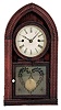 Forestville Mfg. Co., J.C. Brown, Bristol, Conn., 8 day, time and strike, brass fusee-spring driven movement in a rippled molding round Gothic or "beehive" case.