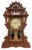 Seth Thomas Clock Co., Thomaston, Conn., "Eclipse" shelf clock with a spring driven 8 days time and strike (half hour) Lyre movement in a walnut case.