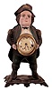 Unsigned (these were sold by the American Clock Co., Waterbury Clock Co. and others) "Continental" blinking eye cast iron clock with a cast iron case cast by Bradley & Hubbard, Meriden, Conn., 30 hour lever timepiece movement.