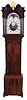 Unsigned, English tall case clock, 8 day, time and bell strike, weight driven movement in a figured mahogany case with Chinese Chippendale decoration on hood below arches and on frieze above trunk door, carved floral rosettes, full round fluted columns flanking dial and matched crotch mahogany veneers on trunk door and base with reeded corners with lamb's tongue stop resting on ogee feet. The painted metal dial has date calendar and moon phase. This style of case was made in the Manchester and Liverpool areas of western England.