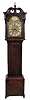 John Law, Beith, (Scotland) tall case clock, 8 day, time, bell strike with calendar, weight driven movement in a mahogany case with broken arch top, fluted rosettes, carved gilded flame finial, fluted corner columns with carved tops flanking hood over a trunk with contoured door top, flanked by top fluted corner columns with carved tops on a base with straight bracket feet. The brass engraved dial has a silvered chapter ring, engraved spandrels and dial center, calendar aperture at 6, sweep second's and signature boss. The unusual calendar mechanism displays both date and month, with specialized marking to indicate 30 or 31 days, in two apertures.
