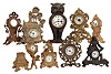 Clocks- 9 (Nine) Novelty cast metal American 30 hour time only; makers include Westclox, Ansonia, Seth Thomas, Waterbury, and one with a replacement Elgin pocket watch movement, late 19th and early 20th centuries