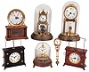 Clocks- 7 (Seven) German: three are Horolovar reproductions, two anniversary 400-day with disk pendulums, "La Mysterieuse" by Hamburg American, and Junghans swinging arm (no figural stand): 20th century