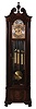 Herschede Clock Co., Cincinnati, Ohio, "Haverford No. 294" hall clock, 8 days, time, strike & chime, three brass weight driven movement playing three tunes on 9 tubes, Westminster, Wittington, Canterbury in a mahogany case with fluted columns with Acanthus carved capitals and bases, cutout base with raised burl panel, bracket feet and beveled glass sides and door, The broken arch top has carved floral rosettes and a finely carved center finial. The brass dial silvered chapter ring and tune and strike / silent selectors, applied cast brass and engraved dial center and spandrels and moon phase, serial no. 628255