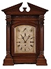 Germany, for the English market, quarter chiming bracket clock, architectural oak case with heavy, molded base, fluted columns with carved capitals, supporting a frieze with carved and applied ornament, and pitched pediment cornice, case sides with pierced wooden frets, finely engraved silvered dialwith Roman numeral chapter, and with chime and rating controls, blued steel hands, massive 8 day, three train fusee movement, chiming Westminster, or On Eight Bells at the quarters, and striking the hours on a large gong