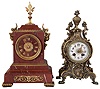Clocks- 2 (Two) French, 8 days, time and strike: red marble with brass accents and bell-striking movement stamped Tiffany and Japy Freres; cast brass with decorated enamel dial and bell-striking Marti movement also stamped Baison & Thomas.