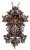 German Black Forest, Gordian Hettich Sohn, carved walnut 8 day spring wound hanging cuckoo, large deer head crest