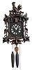 Clocks- 2 (Two) German Black Forest carved walnut 2 weight 30 hour cuckoo clocks; top rooster; fox and grapes; late 19th and early 20th centuries