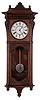 Seth Thomas Clock Co., Thomaston, Conn., "Marcy" wall clock in an oak case with a three train, 8 days, spring driven movement, striking the quarter hours on 2 cup bells and the hours on a cathedral gong,