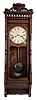 Ansonia Clock Co., New York, NY, "Santa Fe" wall clock with an 8 days double weight timepiece movement in a black walnut case.