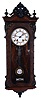 Lenzkirch Clock Co., Germany, miniature Vienna regulator, 8 days, time and strike, spring driven movement marked Lenzkirch in a walnut case also stamped Lenzkirch with burled veneer and brass pendulum with white enamel R/A insert, serial #317557.