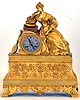 French, 8 days, time and strike spring brass movement with silk thread suspension gilded cast brass case figural mantel clock.
