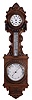 Barometer and time piece (clock) , English, in a carved oak case with enamel thermometer and surmounted by a spring driven time only movement with balance and a 5" white enamel dial