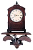 English Bracket Clock in a burl walnut case with brass inlay and a spring driven 8 days time and strike fusee movement.