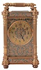 Carriage clocks- 2 (Two): The first with brass Corniche case, Arabic numeral white enamel dial, 8 day timepiece movement with cylinder escapement, signed "John Wanamaker", the other with engraved brass Pillars variant case with green enamel, beveled glasses, Arabic numeral metal dial, 8 day timepiece movement with lever platform