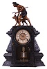 F. Kroeber Clock Co., New York, "Indian Hunter V.P.", 8 day, time and strike spring brass movement metal front mantel clock. This a Nicholas Muller case No. 181 and is stamped on the case. The statue is copied from the original by John Quincy Adams Ward, a famous American sculptor, which was completed in 1886 and stands in Central Park, New York. Herman Muller, son of Nicholas and brother-in-law of Kroeber, was granted a patent for this case design in 1880, seven years after his father's death.