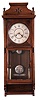 Seth Thomas Clock Co., Thomaston, Conn., "Flora" wall clock with an 8 day weight driven time and strike (cathedral gong) movement in a walnut case.