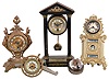 Clocks- 5 (Five) Desk: French 8 day cast brass figural with cylinder platform; cast brass-front 30 hour American with manual calendar; Swiss 30 hour glass paperweight; British United cannon-form 30 hour; Hamburg-American German small portico 8 day with pendulum; early 20th century