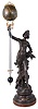 France, large mysterious ball swing clock, 8 days, time only, spring driven movement in extra long 35in grid 'pendulum' arm held aloft by the outstretched arm of "Les Marguerites", statue resting a marbleized wooden base. The statue and plaque bear the name of Aug. Moreau sculpture,