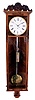 Austrian, 6-light, "Vienna Regulator", 8 day timepiece in a slender mahogany case with satinwood banding, carved top