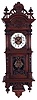 Germany, unsigned Vienna regulator, 8 days, time and strike with bim bam strike, spring driven movement in a carved oak case with carved top, bottom and finials and two part brass and enamel dial and stamped brass pendulum.