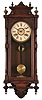 Clocks- 2 (Two): (1) New Haven Clock Co., New Haven, Conn., "Eclipse" wall hanging clock with a spring driven 8 day time and simple calendar movement in a solid oak case and made for the American Wringer Co., 99 Chambers St., NY. c1910. (2) Ansonia Clock Co., New York, NY, "Queen Elizabeth" wall hanging clock with a spring driven 8 day time & half-hour strike movement in an oak case. c1880.