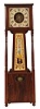 Shelf clock, an unusual banjo derivative, mahogany case with square head and box, on turned feet and with turned columns, the throat sides joined to the upper and lower sections with quarter round, reeded elements, Roman numeral painted dial, reverse painted throat glass, steel hands, 8 day timepiece movement, cast iron weight, 19th century