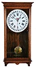 Clocks- 2 (Two): (1) Seth Thomas Clock Co., Thomaston, Conn., wall hanging clock with a spring driven 8 day timepiece movement with a simple calendar mechanism in a solid oak case. c1920. (2) Seth Thomas Clock Co., Thomaston, Conn., "Senate 5W" wall hanging clock with a spring driven 8 day timepiece movement in a solid oak case. c1940.