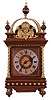 Germany, bracket clock, 8 days, time and strike, spring driven movement in a walnut case with brass twist columns and other brass trim and appliques and surmounted by arched brass structure with silvered chapter ring.