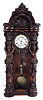 Germany, paper mache Vienna regulator wall clock, 8 days, time only, weight driven movement in a soft wood case with paper mache front depicting two female nudes flanking hood door supporting capitals above heads. The two part white enamel dial has Roman numerals.