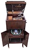 Regina Music Box Co., Rahway, NJ. "Style 246 Regina phone serial number 2460162. This was the last model of combination disc music box and 78 rpm phonograph with interior horn. Only 190 examples of this model were made and shipped. The music box has a short bed plate and double comb for superb sound. It plays 15 1/2 inch discs. The floor standing case has storage below for discs and records.