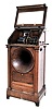 Regina Music Box Co., Rahway, NJ. Coin operated "Hexaphone", Model 104 with wood horn, serial #1040627. This predecessor to the modern-day juke box. It will play one of six Edison 4-miinute Blue Amerole cylinders selected after a nickel is inserted.