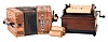 Two musical instruments. (1) An American-made roller organ with one 8" long paper roll. (2) A "Tansbar" player concertina made by A. Zuleger of Leipzig Germany with six 4.5 inch paper rolls.