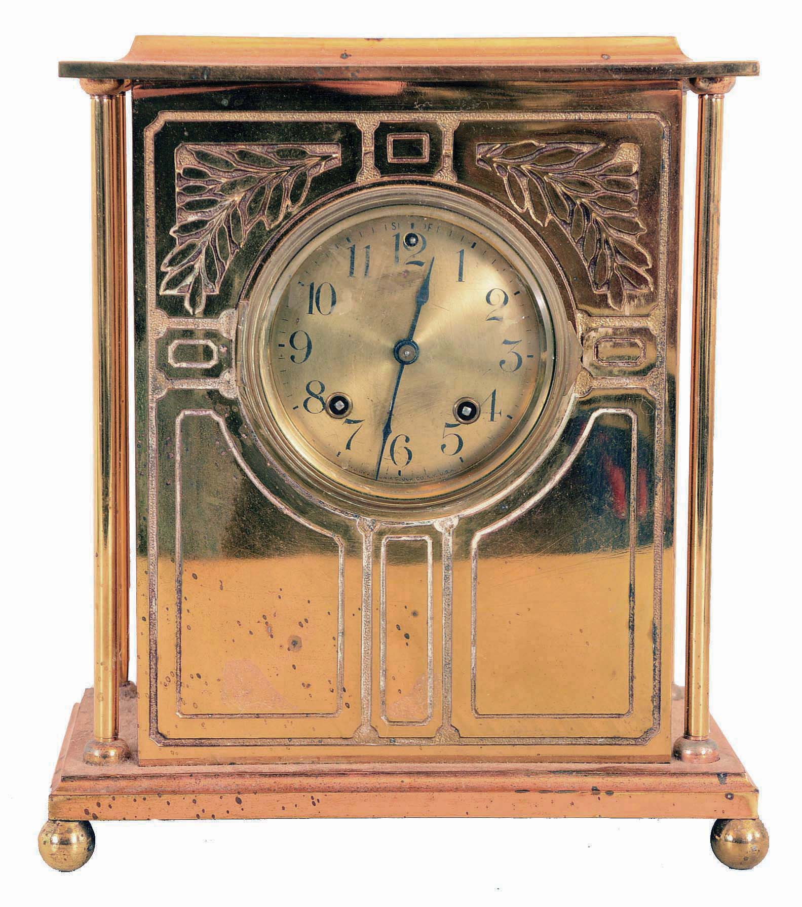 Ansonia Clock Co., New York, NY, "Sussex" mantel clock with a spring driven 8 days time &amp; half hour strike movement in a brass plated case with four free standing columns. — Antique Clocks Price Guide