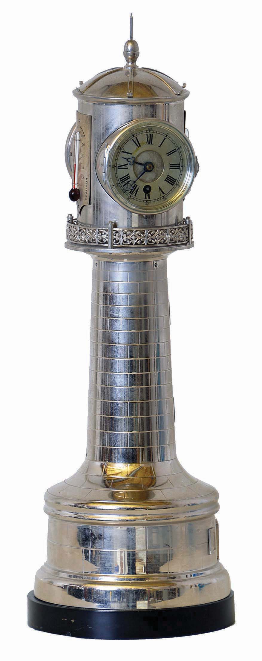 French, Lighthouse automaton timepiece, from the "Industrial Series" of clocks made popular by Guilmet. The upper rotating beacon carries two thermometers with Fahrenheit, Centigrade and Reaumur scales, plus an aneroid barometer, and a platform type 8 day movement — Antique Clocks Price Guide