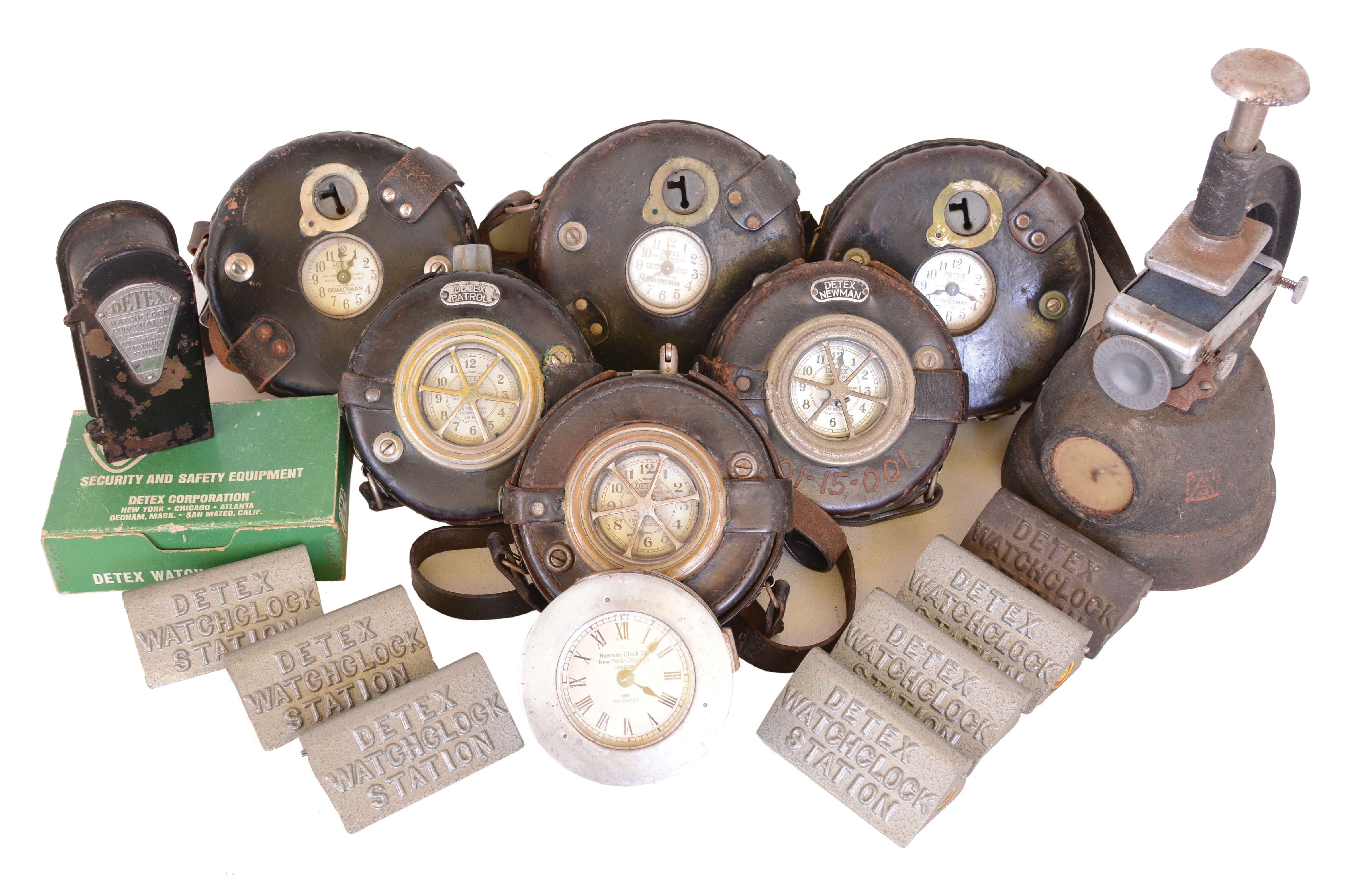 Clocks- 8 (Eight) time recording devices: (1) 7 (Seven) Detex Watchclock Corporation watchman's clocks, six in leather holsters with seven watch station markers and keys; (2) Simplex Time Recorder Co., with punch mechanism — Antique Clocks Price Guide