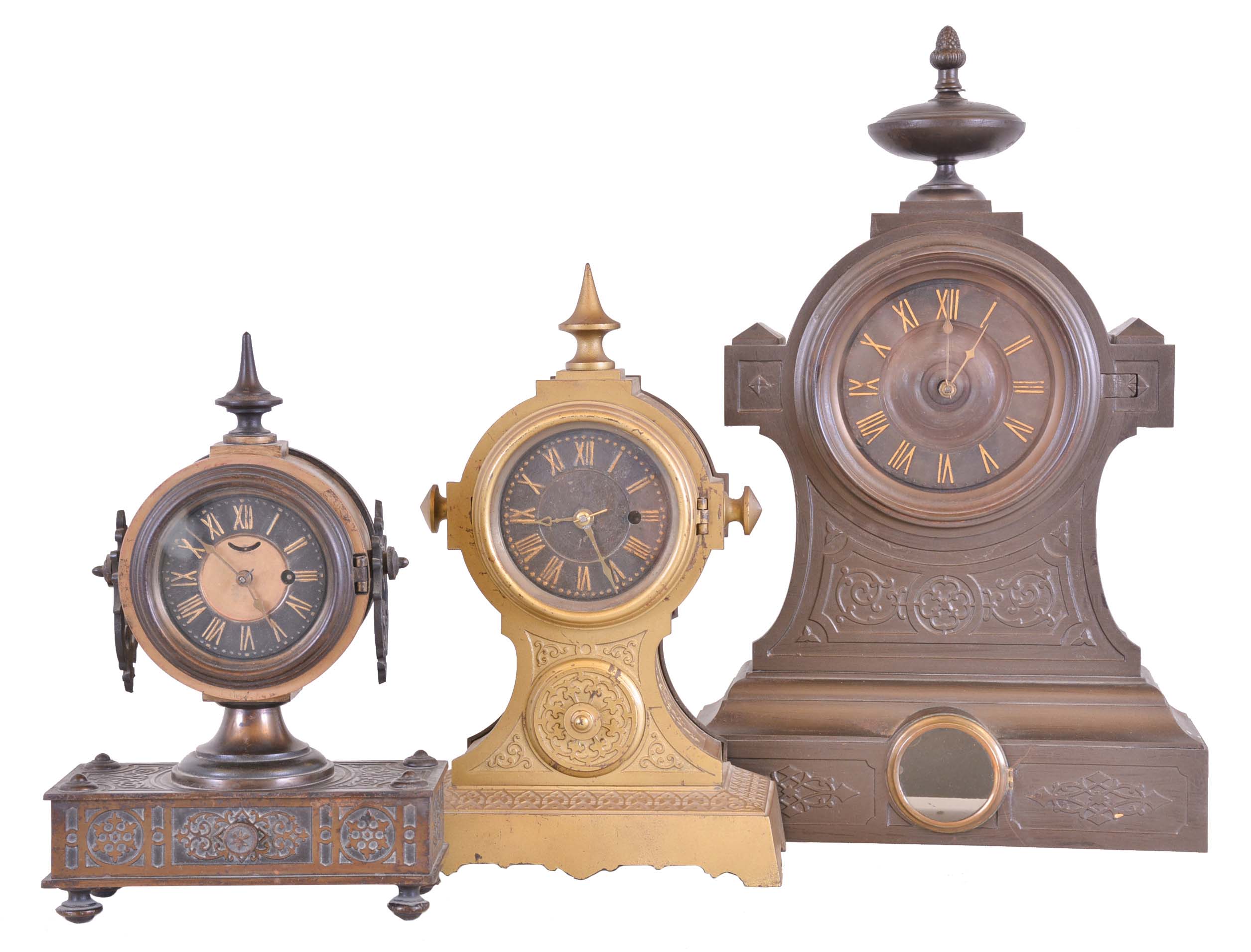 Clocks- 3 (Three): (1) American Clock Co., New York "Tucker Bronze", 30 hour, spring brass movement shelf clock. (2) Ansonia Brass &amp; Copper Co., Ansonia, Conn. "Tucker No. 2", 30 hour, spring brass lever movement shelf clock. (3) American Clock Co., New York, "Tucker Bronze", 8 day, time and strike spring brass movement iron case shelf clock. — Antique Clocks Price Guide