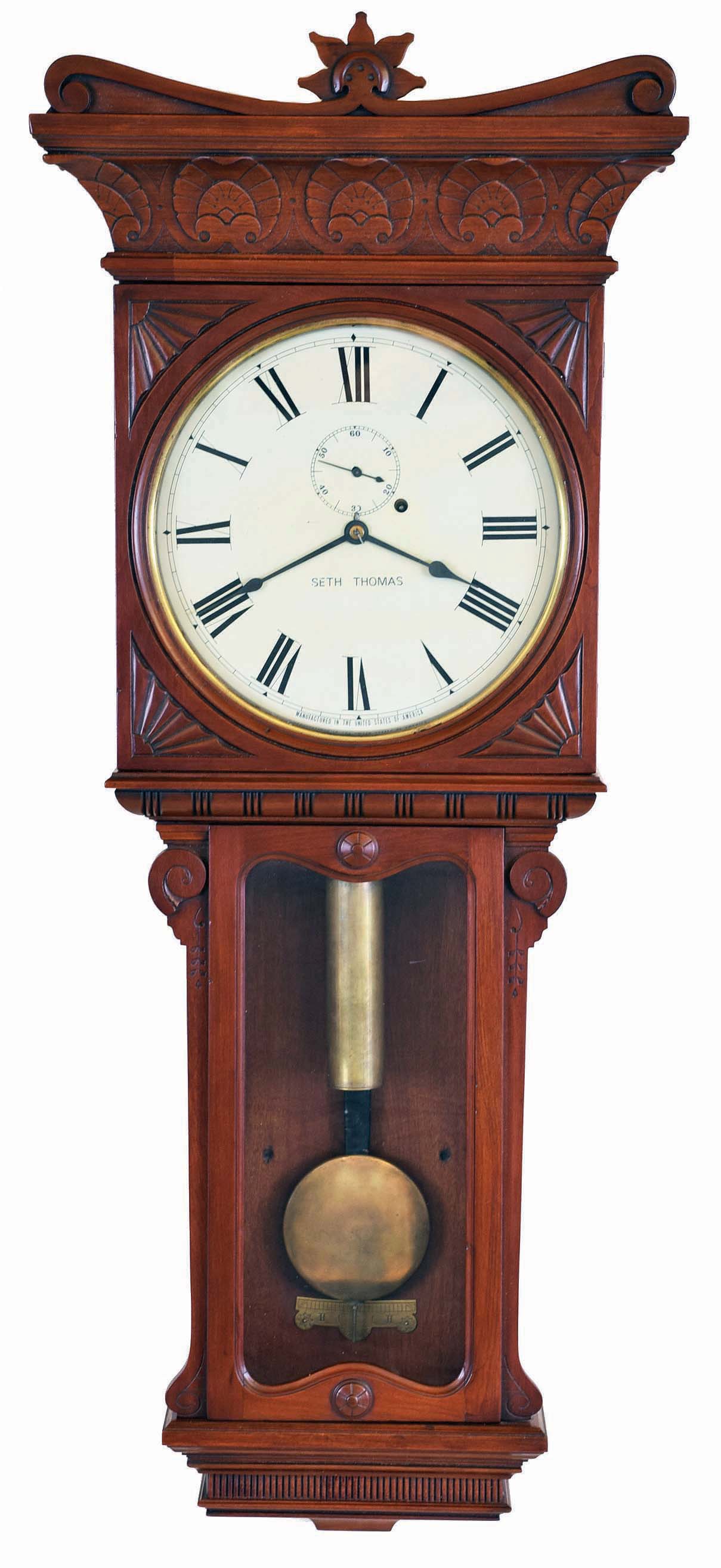 Seth Thomas Clock Co., Thomaston, Conn., "Regulator No. 7" hanging clock with an 8 day weight driven timepiece movement in a cherry case. — Antique Clocks Price Guide