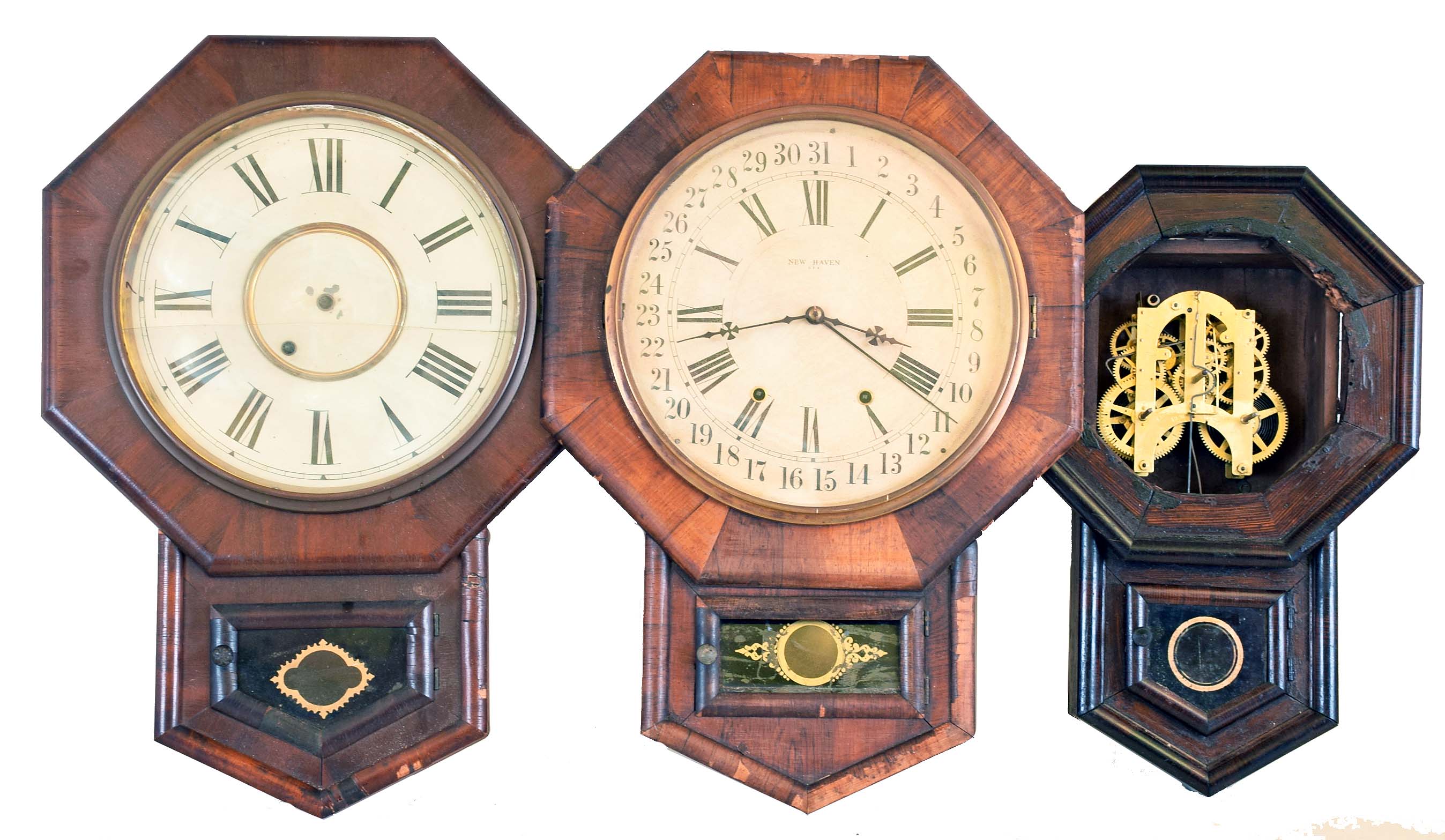Clocks- 5 (Five): (1) New Haven Clock Co., New Haven, Conn., Short Drop wall hanging clock with a spring driven 8 day time, strike and simple calendar movement in a rosewood veneered case, c1890. (2) New Haven Clock Co., New Haven, Conn., Short Drop wall hanging clock with a spring driven 8 day timepiece movement in a mahogany veneered case, c1890, (3) New Haven Clock Co., New Haven, Conn. "Ventura" short drop wall hanging clock with a spring driven 8 day timepiece movement in a rosewood veneered case with advertising, c1890. (4) Ansonia Brass &amp; Copper, Ansonia, Conn., Short Drop wall hanging clock with a spring driven 8 day time and strike movement in a rosewood veneered case, c1870. (5) Asian short drop wall clock with an Ansonia 8 day spring driven time and strike movement, c1890. — Antique Clocks Price Guide