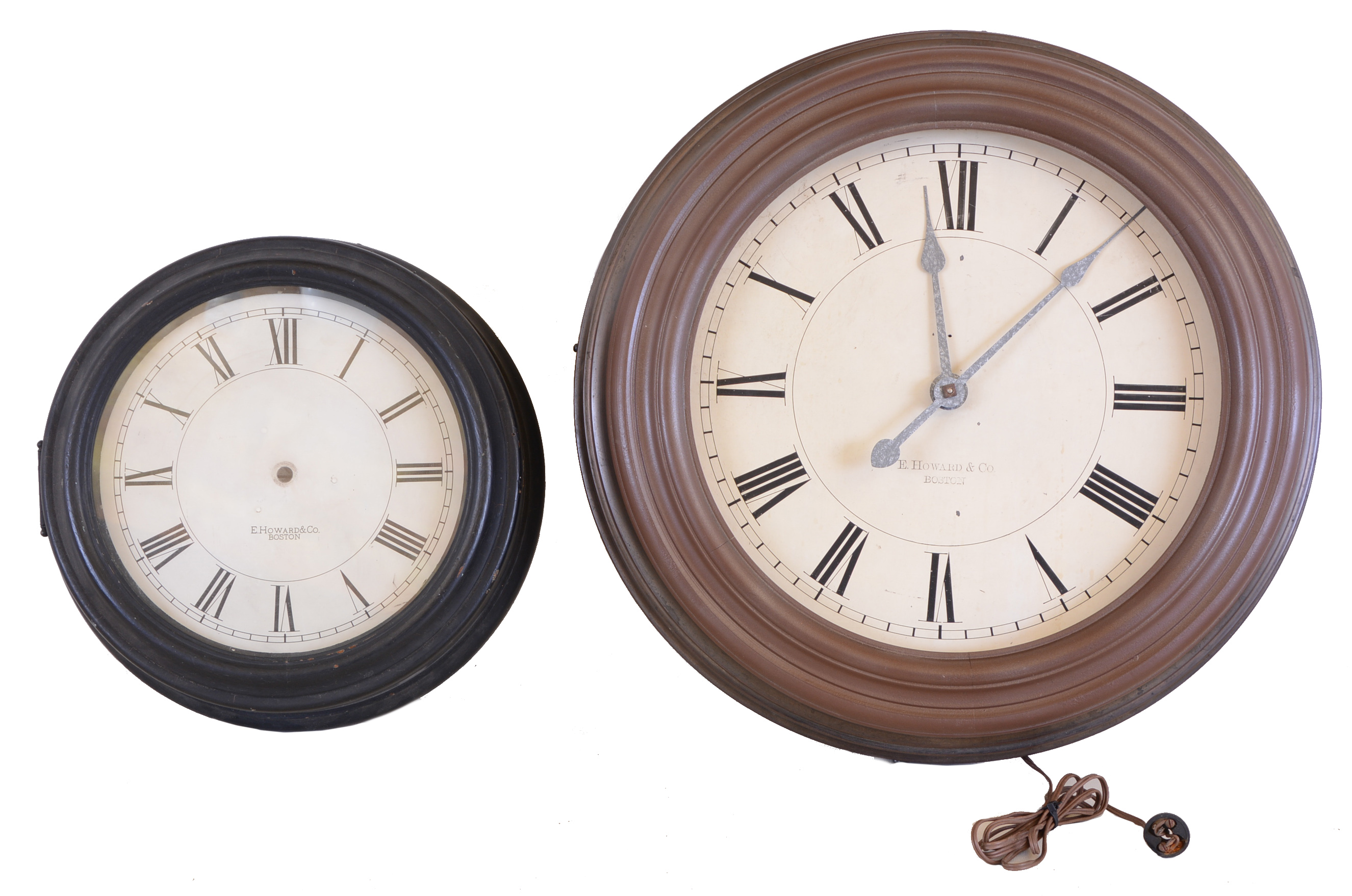 Clocks- 2 (Two) E Howard &amp; Co., Boston, electric clocks: the first with 24 1/2 inch metal case, Roman numeral painted dial, signed nickel plated movement, the other a case only, 17 inch turned wooden case, and Roman numeral painted dial — Antique Clocks Price Guide