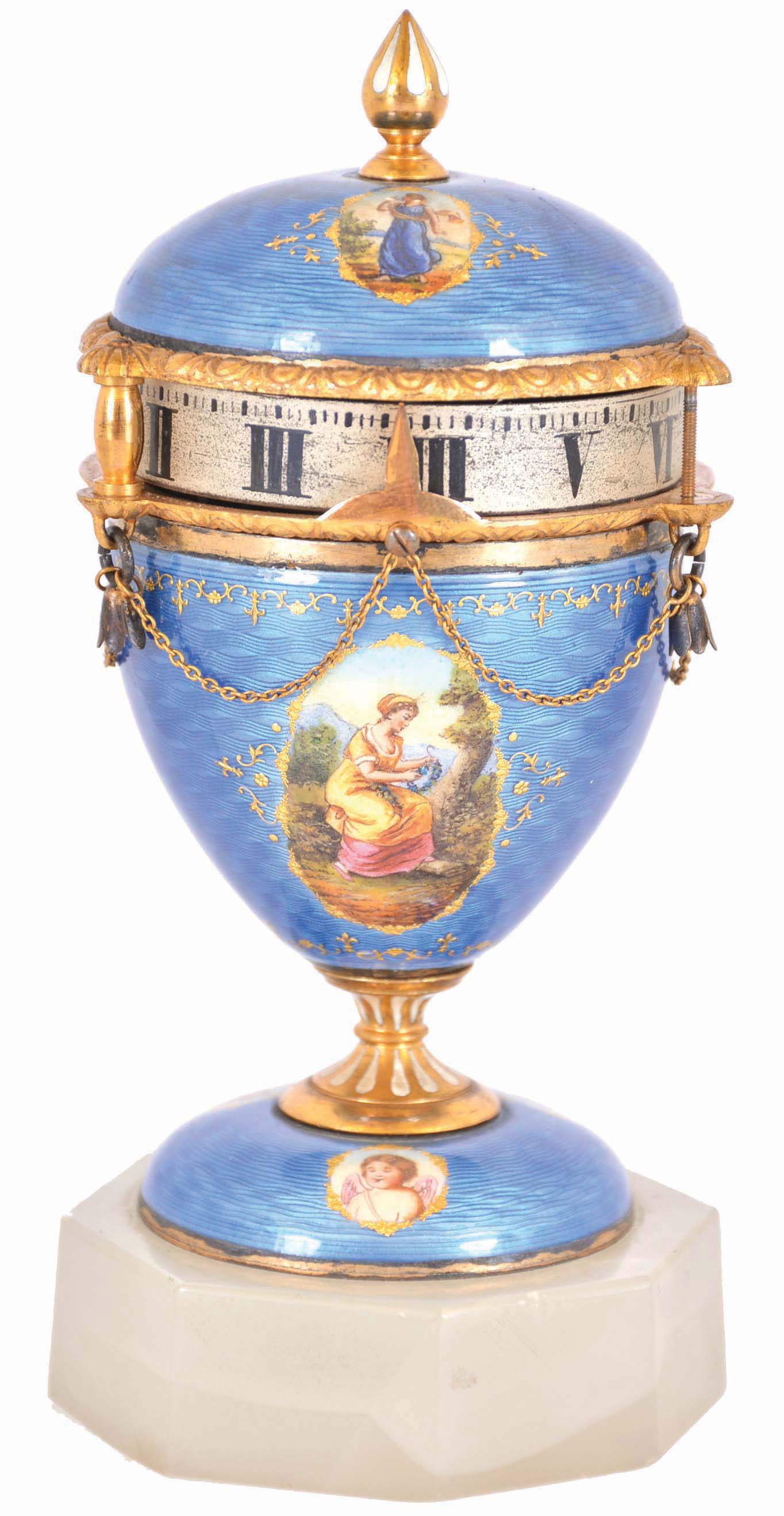 Switzerland, miniature urn form annular clock, the case with blue guilloche enamel and gilt molding, decorated with 7 paillon framed polychrome enamel portraits, the finial and stem with white enamel accents, and Roman numeral silvered dial, all on an octagonal, polished stone base, c1900 — Antique Clocks Price Guide