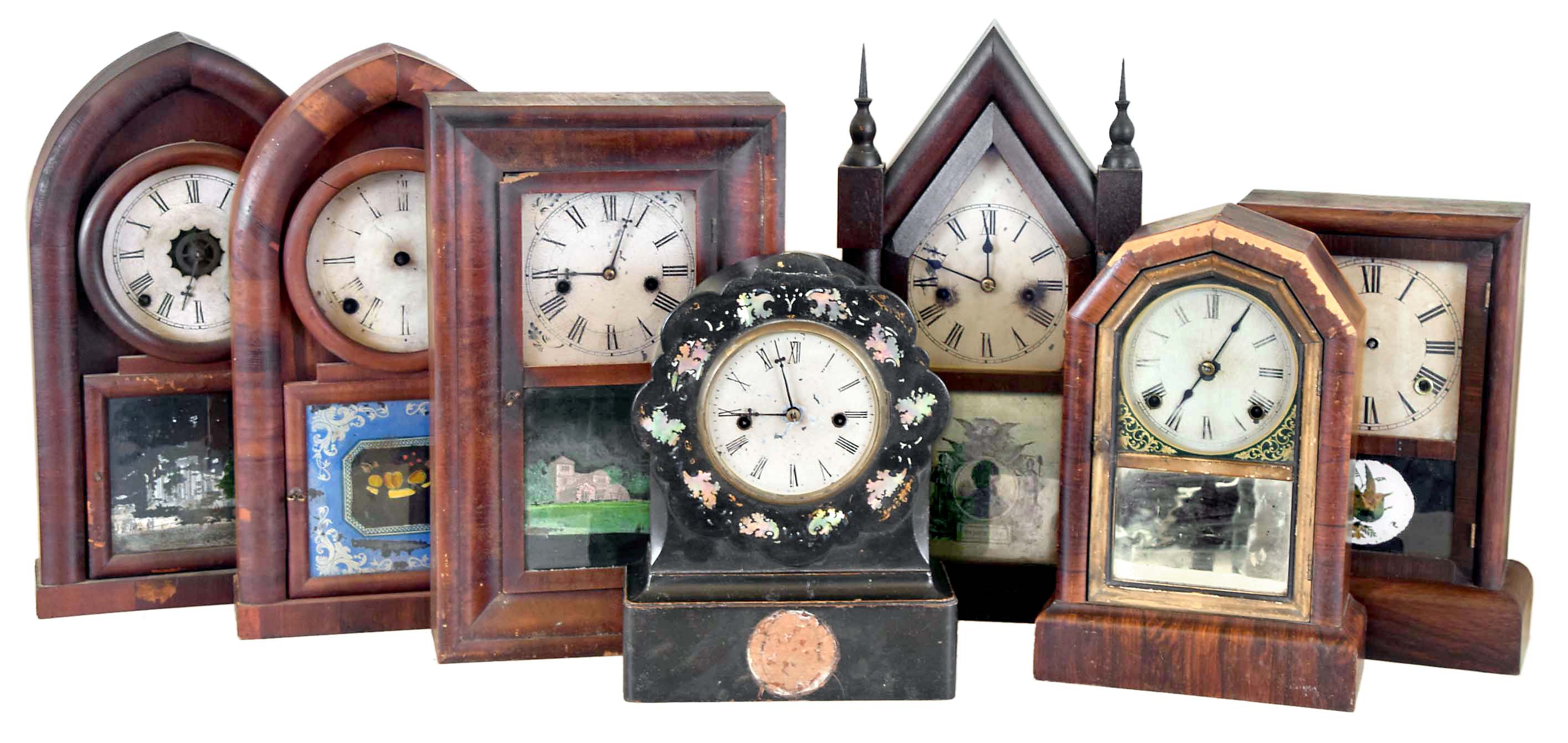 Clocks- 7 (Seven): (1) Unknown, 8 day, time and strike spring brass movement beehive clock, c1860 (2) Daniel Pratt &amp; Sons, Reading, Mass., 8 day, time and strike spring brass movement beehive clock, c1850. (3) Waterbury Clock Co., Waterbury, Conn., 30 hour, time and strike spring brass movement Sharp Gothic or steeple clock, c1860. (4) Seth Thomas Clock Co.?, Thomaston, Conn. 8 day, time and strike spring brass movement shelf clock, c1865 (5) Chauncey Jerome, New Haven, Conn. 8 day, time and strike spring brass fusee movement shelf clock, c1850 (6) Ansonia Brass &amp; Copper Co., Ansonia, Conn., 8 day, time and strike spring brass movement shelf clock, c1865 (7) Waterbury Clock Co., Waterbury, Conn., 30 hour, time and strike spring brass movement OG shelf clock, c1865 — Antique Clocks Price Guide