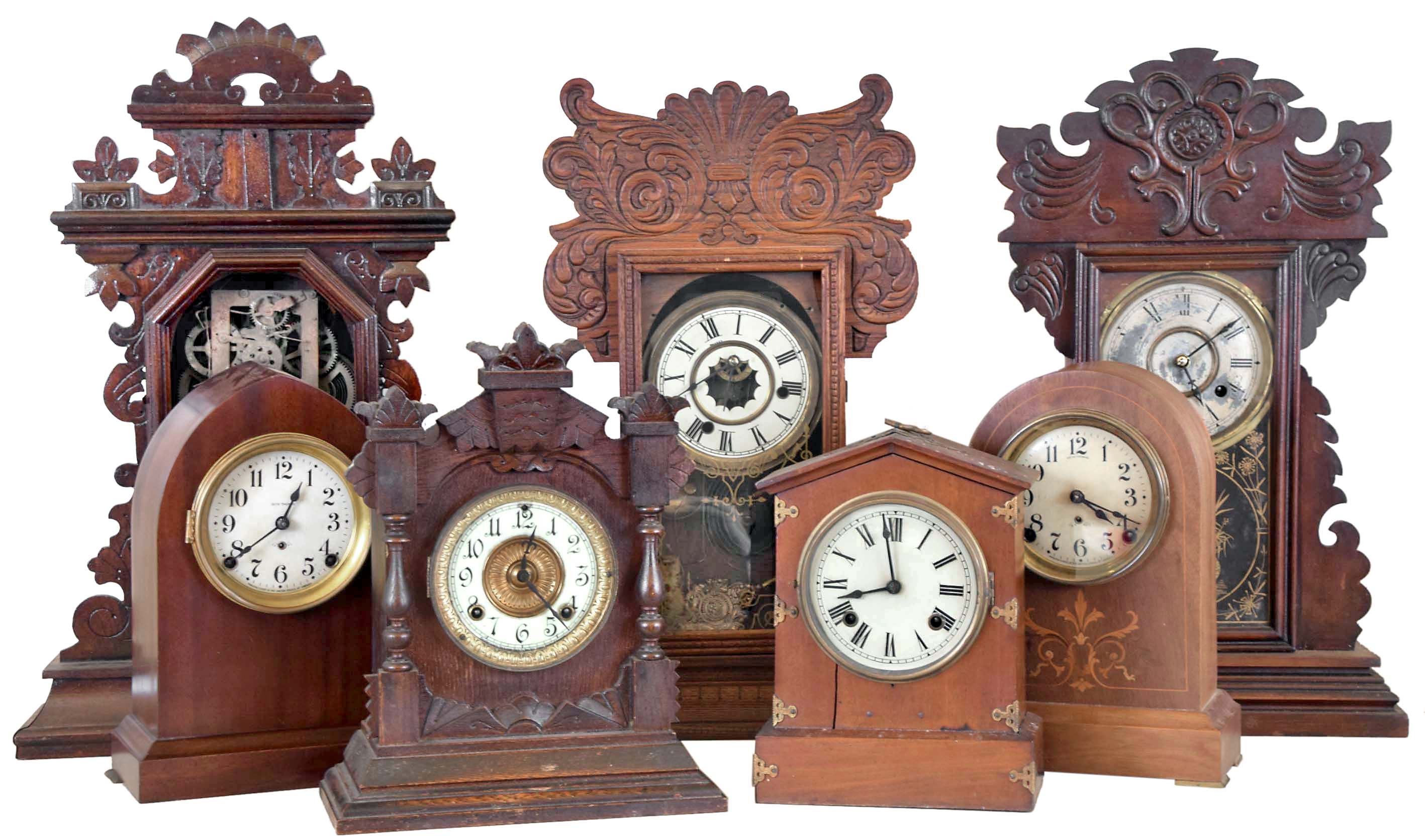 Clocks- 7 (Seven): (1) Waterbury Clock Co., Waterbury, Conn., 8 day, time, strike and alarm spring brass movement shelf clock, c1900 (2) New Haven Clock Co., New Haven, Conn., 8 day, time and strike spring brass movement shelf clock, c1890 (3) E. Ingraham &amp; Co., Bristol, Conn., 8 day, time and strike spring brass movement shelf clock, c1890 (4) Ansonia Clock Co., New York, NY 8 day, time and strike spring brass movement cabinet series shelf clock, c1890 (5) Seth Thomas Clock Co., Thomaston, Conn., 8 day, time and strike spring brass movement round top mantel clock, c. 1910. (6) New Haven Clock Co., New Haven, Conn., 8 day, time and strike spring brass movement mantel clock, c1905 (7) Seth Thomas Clock Co., Thomaston, Conn., 8 day, time and strike spring brass movement beehive mantel clock, c1910 — Antique Clocks Price Guide